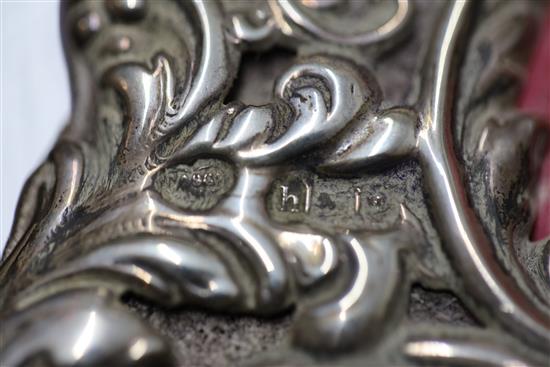 A pair of Edwardian repousse silver mounted photograph frames, by Goldsmiths & Silversmiths Co Ltd,